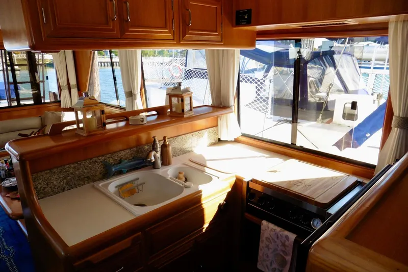 Kokomo Yacht Photos Pics Interior of 2000 Ocean Alexander 423 Classico yacht with kitchen and marina view.