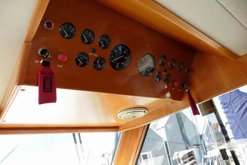 Kokomo Yacht Photos Pics Control panel of 2000 Ocean Alexander 423 Classico yacht with gauges and keychains.