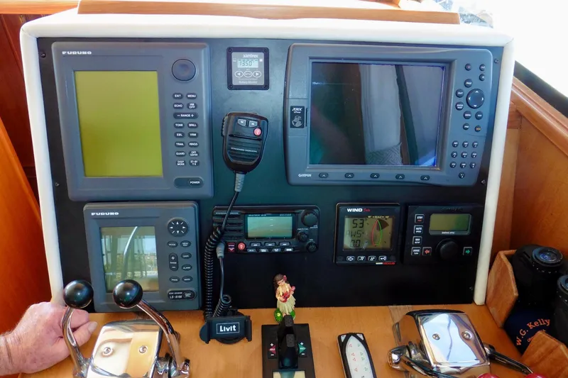 Kokomo Yacht Photos Pics Cockpit dashboard of 2000 Ocean Alexander 423 Classico with navigation instruments and controls.