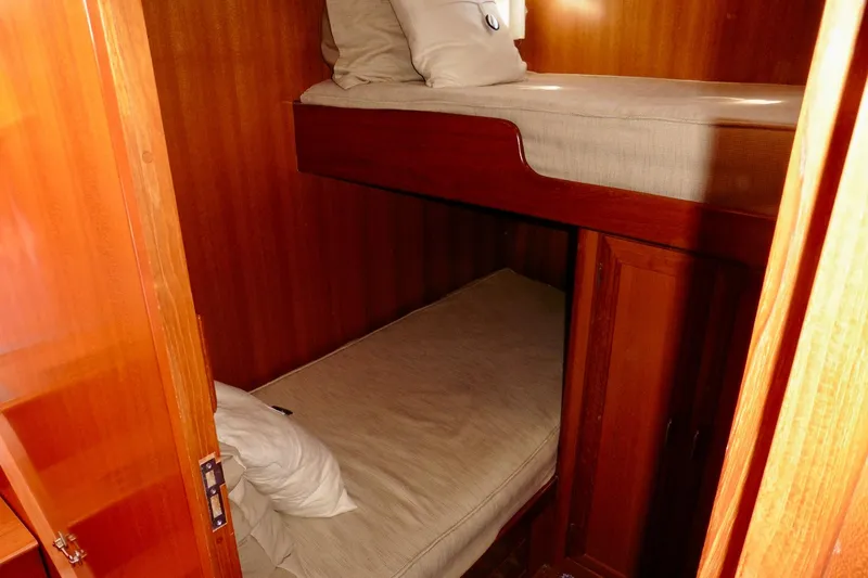 Kokomo Yacht Photos Pics Bunk beds in 2000 Ocean Alexander 423 Classico yacht cabin with wooden interior.