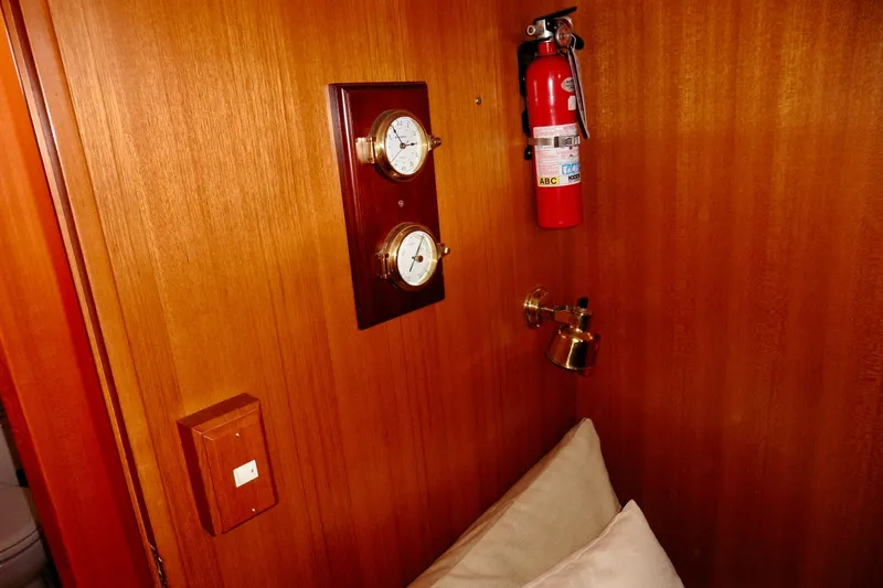 Kokomo Yacht Photos Pics Wooden interior of 2000 Ocean Alexander 423 Classico with fire extinguisher and gauges.