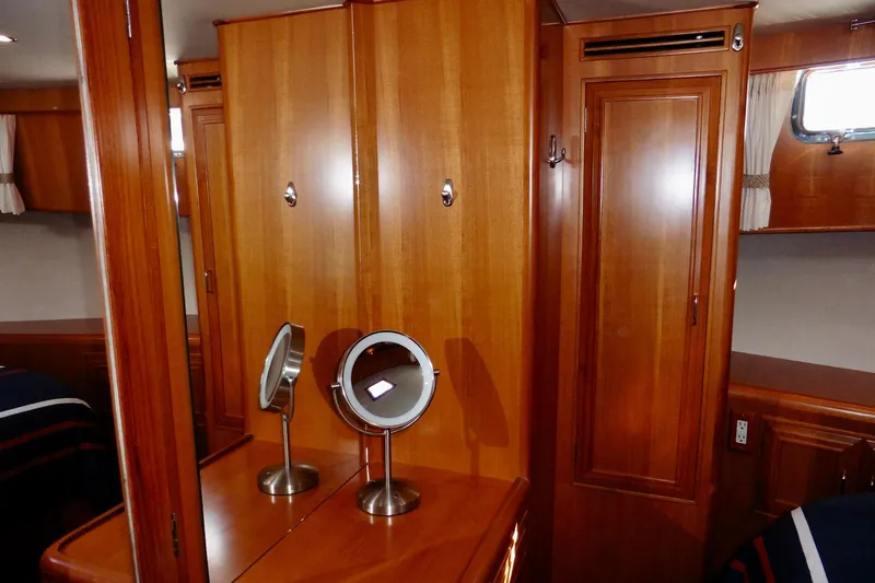 Kokomo Yacht Photos Pics Luxurious wooden interior of 2000 Ocean Alexander 423 Classico yacht cabin with mirrors.