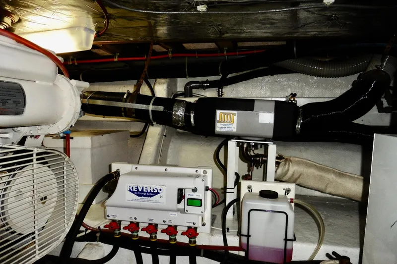 Kokomo Yacht Photos Pics Engine room of 2000 Ocean Alexander 423 Classico with Reverso oil change system.