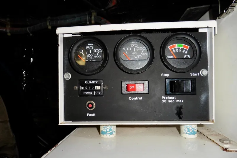 Kokomo Yacht Photos Pics Control panel of a 2000 Ocean Alexander 423 Classico boat, displaying gauges and switches.