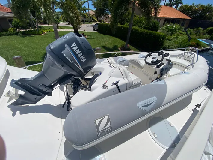 Pretty Fine Yacht Photos Pics Inflatable boat with Yamaha outboard motor on Riviera 47 Convertible, 2003 model.