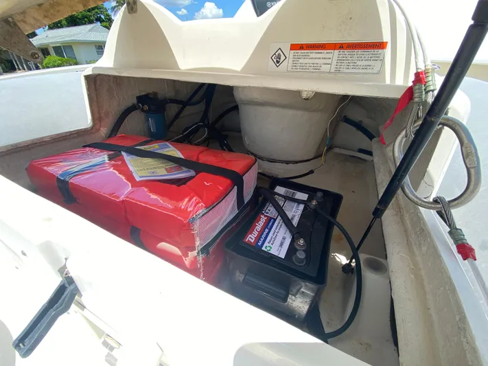 Pretty Fine Yacht Photos Pics 2003 Riviera 47 Convertible boat compartment with battery and safety equipment.