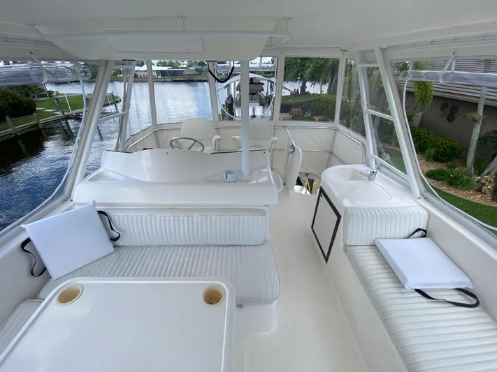 Pretty Fine Yacht Photos Pics 2003 Riviera 47 Convertible yacht interior with white seating and water view.