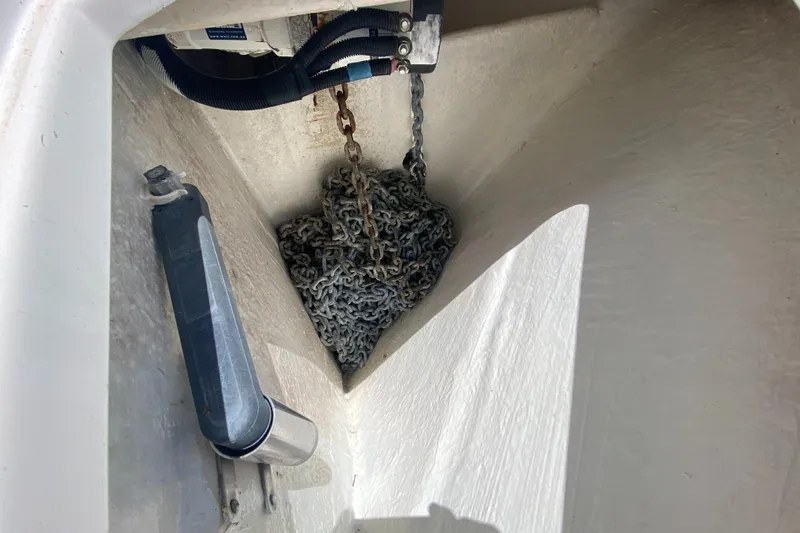 Pretty Fine Yacht Photos Pics Anchor chain compartment of 2003 Riviera 47 Convertible boat.