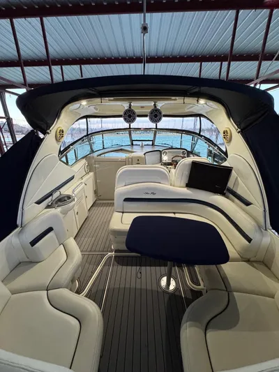 Lucky 9 Yacht Photos Pics Interior of a 2007 Sea Ray 38 Sundancer yacht with luxurious seating and helm.