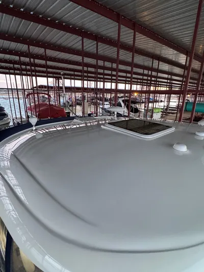 Lucky 9 Yacht Photos Pics 2007 Sea Ray 38 Sundancer yacht docked under metal canopy.