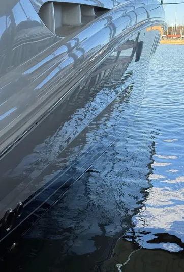 Lucky 9 Yacht Photos Pics Close-up of 2007 Sea Ray 38 Sundancer yacht reflecting on water.