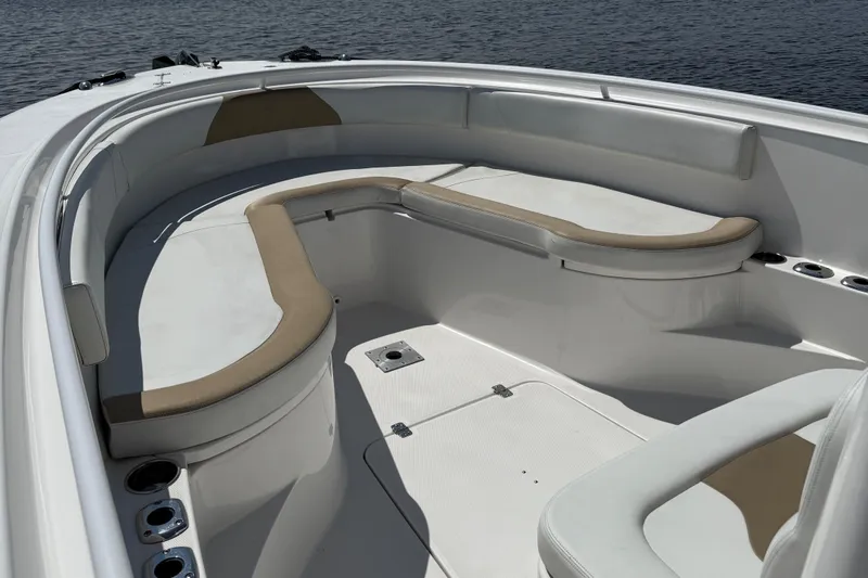  Yacht Photos Pics 2017 Edgewater 320CC boat interior with cushioned seating and cup holders.