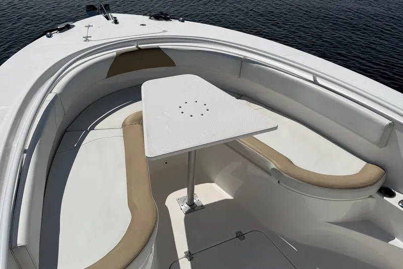  Yacht Photos Pics 2017 Edgewater 320CC boat interior with seating and table on calm water.