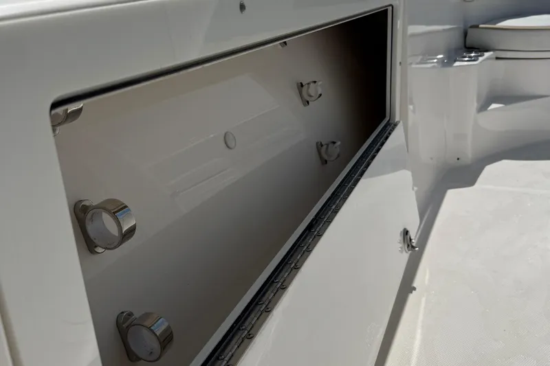  Yacht Photos Pics Storage compartment on a 2017 Edgewater 320CC boat, showcasing interior details.