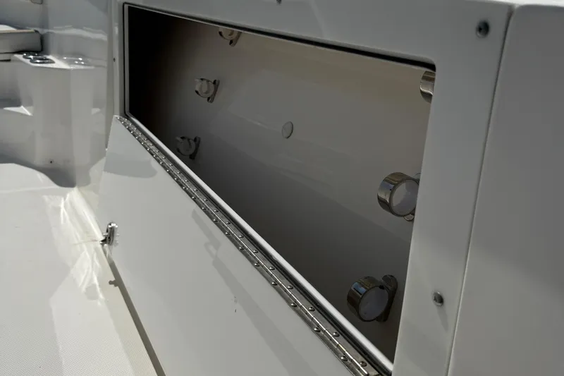  Yacht Photos Pics 2017 Edgewater 320CC boat storage compartment, open and empty, showcasing interior details.