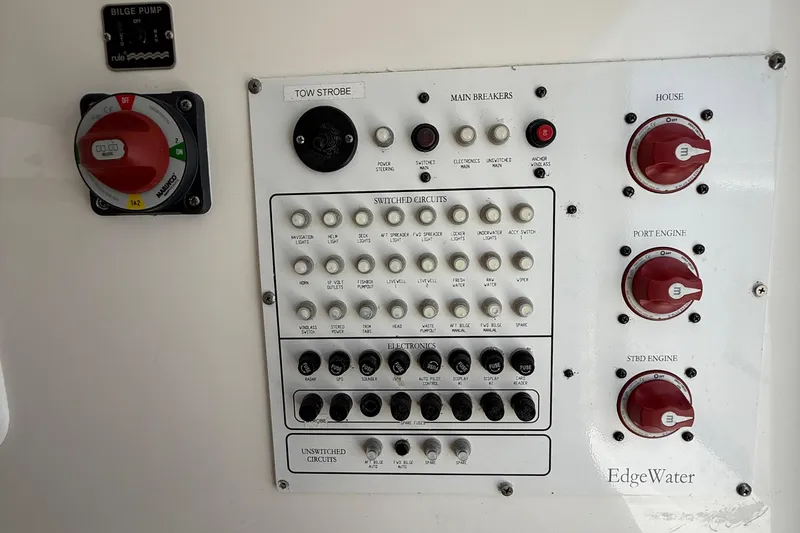  Yacht Photos Pics Control panel of a 2017 Edgewater 320CC boat with switches and circuit breakers.