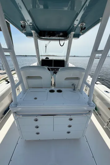 Yacht Photos Pics 2017 Edgewater 320CC boat interior with helm station and ocean view.