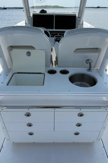  Yacht Photos Pics 2017 Edgewater 320CC boat interior with sink, storage, and control panel.