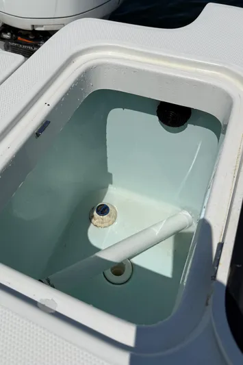  Yacht Photos Pics Livewell on 2017 Edgewater 320CC boat, filled with water, showcasing interior design.