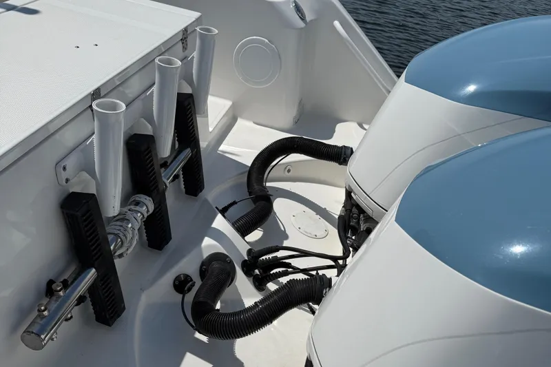  Yacht Photos Pics Edgewater 320CC 2017 boat with dual engines and rod holders on deck.