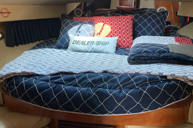 Dealer-ship Yacht Photos Pics Luxurious cabin interior of 2004 Fountain 48 Express Cruiser with stylish bedding.