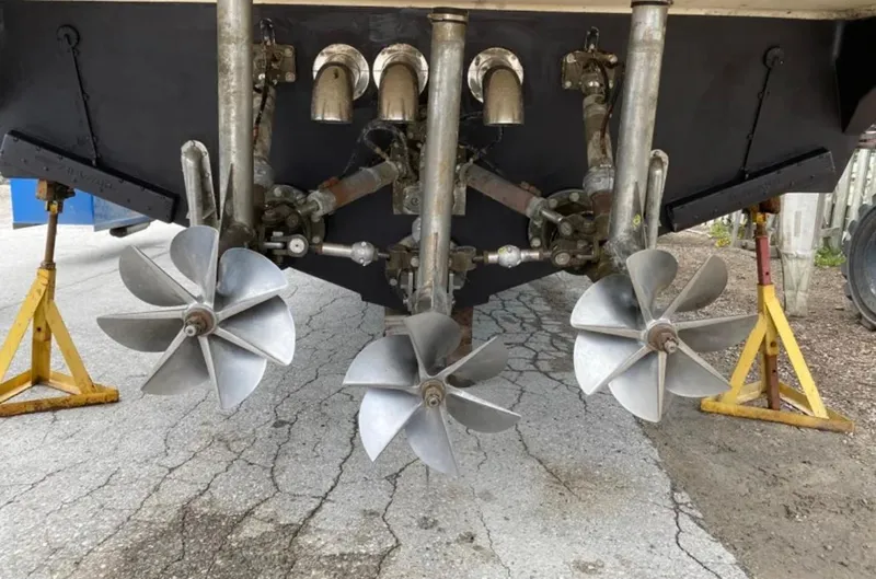 Dealer-ship Yacht Photos Pics 2004 Fountain 48 Express Cruiser propellers on dry dock, showcasing dual propeller system.