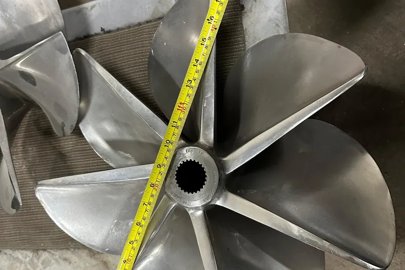 Dealer-ship Yacht Photos Pics Propeller of 2004 Fountain 48 Express Cruiser with measuring tape for size reference.