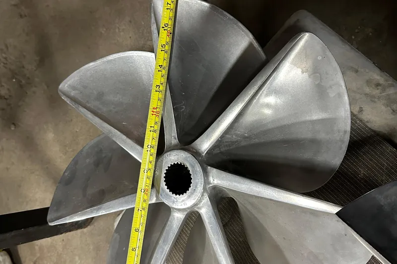 Dealer-ship Yacht Photos Pics Propeller of 2004 Fountain 48 Express Cruiser with measuring tape for size reference.