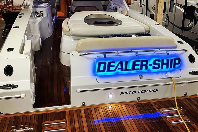 Dealer-ship Yacht Photos Pics 2004 Fountain 48 Express Cruiser with illuminated "DEALER-SHIP" sign, docked at Port of Goderich.