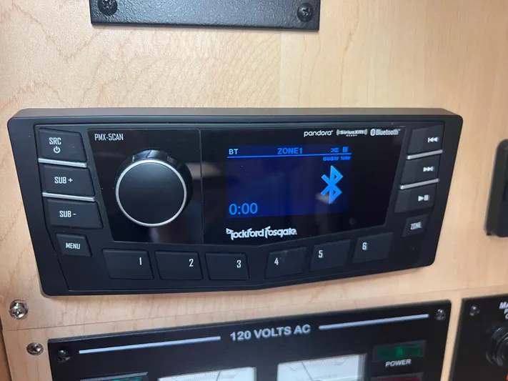 Baileys Dinghy Yacht Photos Pics Rockford Fosgate stereo system on 2010 Sea Ray 350 Sundancer boat dashboard.