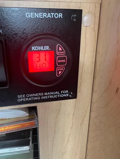 Baileys Dinghy Yacht Photos Pics Kohler generator display showing 31 hours on a 2010 Sea Ray 350 Sundancer.