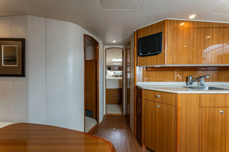 Wig Wag Yacht Photos Pics Interior of 2009 Viking 45 Open yacht with wooden cabinetry and modern amenities.