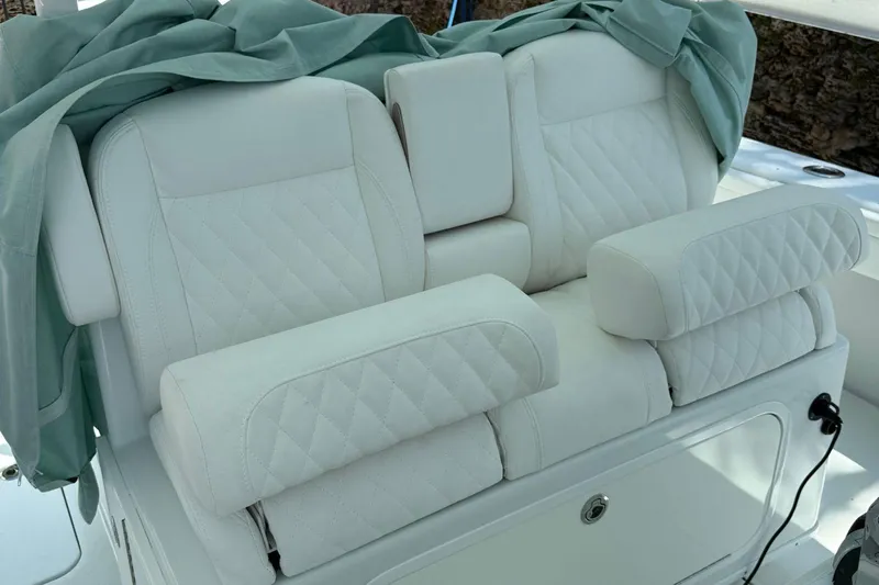  Yacht Photos Pics Luxurious white seating on a 2021 Yellowfin 39 boat, featuring quilted upholstery.