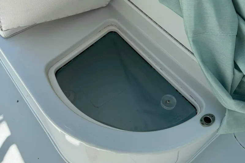  Yacht Photos Pics 2021 Yellowfin 39 boat detail showing a storage compartment with a clear lid.