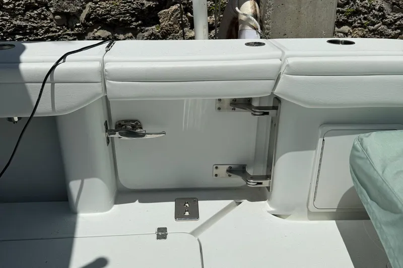  Yacht Photos Pics 2021 Yellowfin 39 boat interior with white seating and storage compartments.