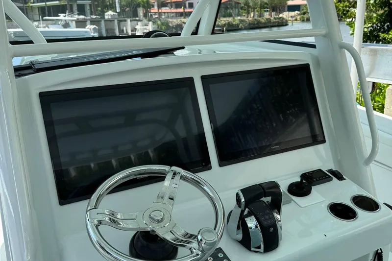  Yacht Photos Pics 2021 Yellowfin 39 boat dashboard with dual screens and steering wheel.