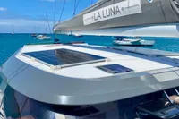 2022 Nautitech 40 Open catamaran with solar panels, anchored in a sunny bay.
