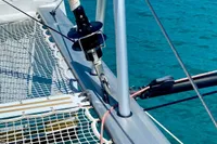 Nautitech 40 Open 2022 catamaran deck with netting over turquoise water.