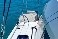 Nautitech 40 Open 2022 catamaran deck with ocean view and anchored boats.