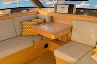 Interior of 2022 Nautitech 40 Open catamaran with cozy seating and scenic marina view.