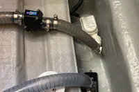 Bilge area of 2022 Nautitech 40 Open with hoses and pump system.