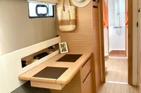 Interior of 2022 Nautitech 40 Open yacht, featuring a modern desk and bathroom.