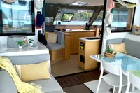 Interior of 2022 Nautitech 40 Open catamaran, featuring modern seating and decor.
