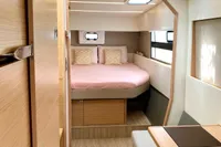 Interior of 2022 Nautitech 40 Open catamaran, featuring a cozy bedroom and modern design.