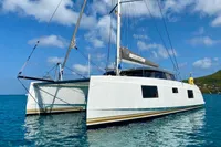 2022 Nautitech 40 Open catamaran sailing on clear blue waters.