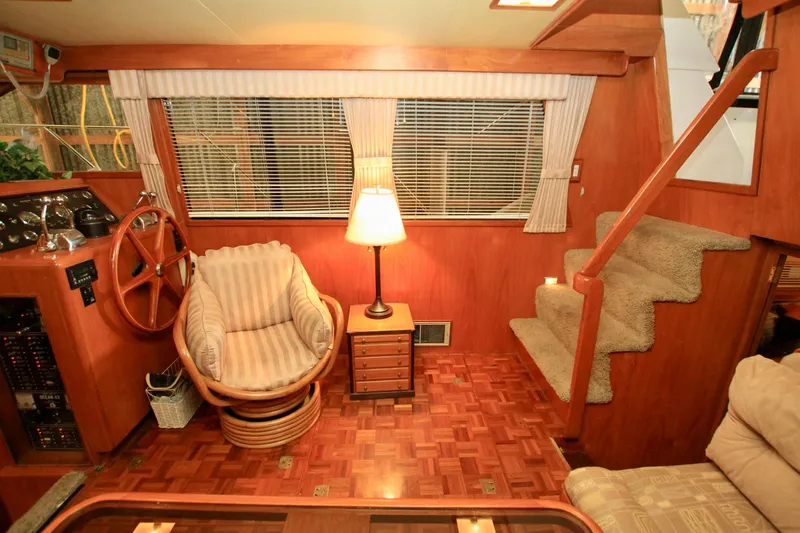 Sea Mistress Yacht Photos Pics Interior of 1987 Ocean Alexander 42 yacht with wooden decor and cozy seating.