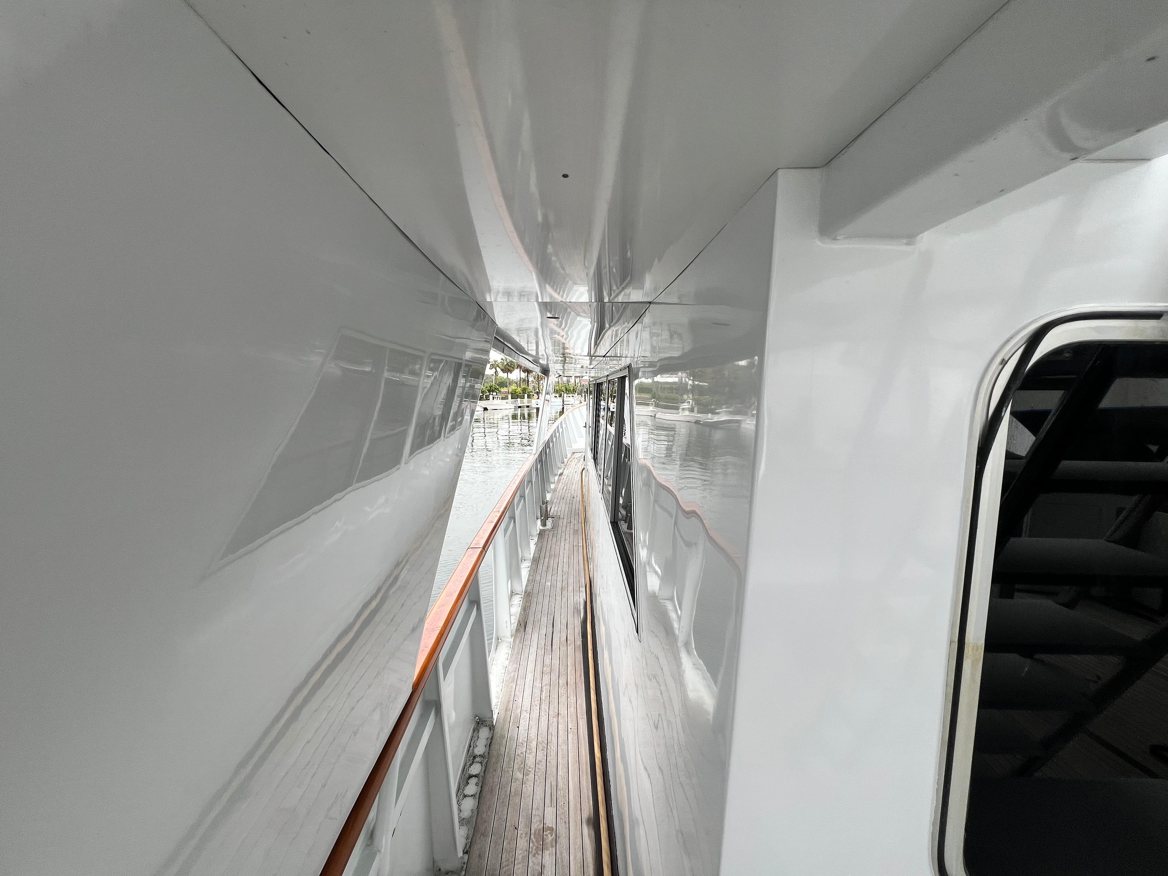 Side deck view of a 1988 Custom Steel Motor Yacht, showcasing sleek design and craftsmanship.
