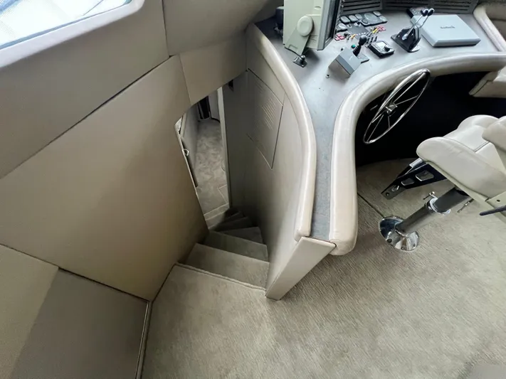 Ain't No Big Thing Yacht Photos Pics Interior of 1988 Custom Steel Motor Yacht with helm station and staircase.