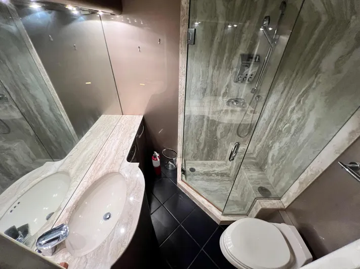 Ain't No Big Thing Yacht Photos Pics Luxurious yacht bathroom with marble sink, glass shower, and modern fixtures, 1988 Custom Steel Motor Yacht.