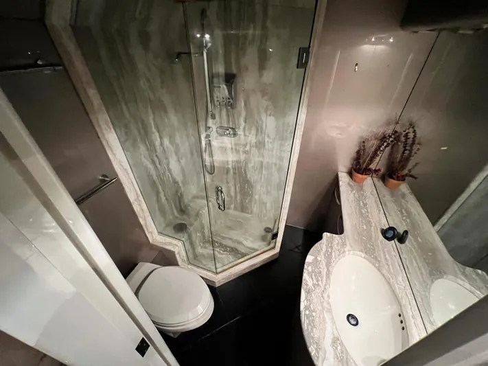 Ain't No Big Thing Yacht Photos Pics Luxurious yacht bathroom with marble shower, dual sinks, and modern fixtures, 1988 Custom Steel Motor Yacht.